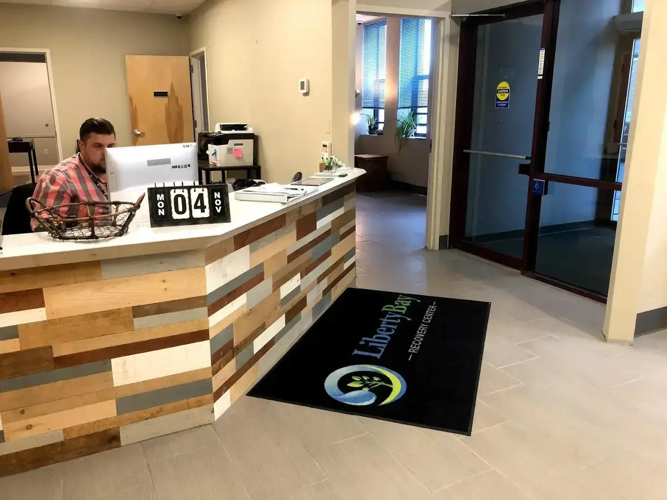 Liberty Bay Recovery Center reception in Portland with staff at desk
